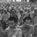 CAMBODIA, Phnom Penh. 10/07/2014: Buddhist monks praying on the first of a three day ceremony where the ashes of King Norodom Sihanouk, deceased on October 15th 2012 at the age of 89, are being transported from the Royal Palace to a stupa inside the compound.