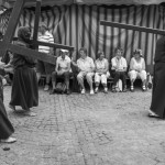 BELGIUM, Veurne (West Vlaanderen). 27/07/2014: Penitents carrying their cross during the procession in the streets of Veurne.