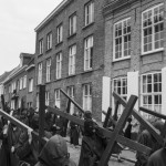 BELGIUM, Veurne (West Vlaanderen). 27/07/2014: Penitents carrying their cross during the procession in the streets of Veurne.