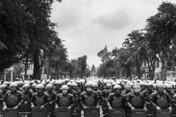 CAMBODIA, Phnom Penh. 5/10/2014: Police forces preventing protesters to reach the Ministry of Education during a demonstration on World Teacher Day.